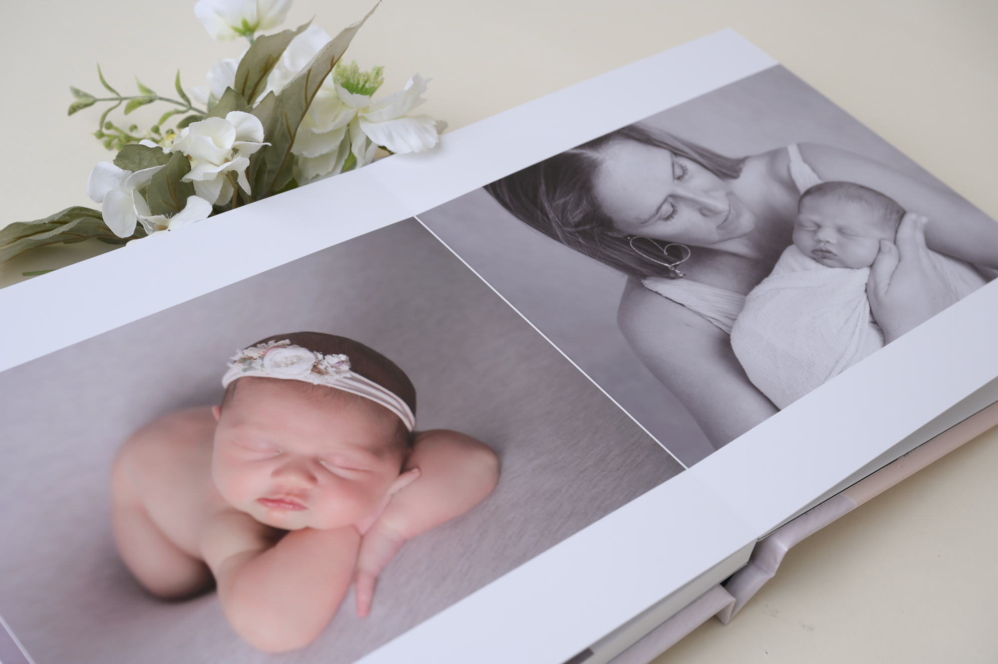 Newborn photo album, baby girl, flower decorates the scene